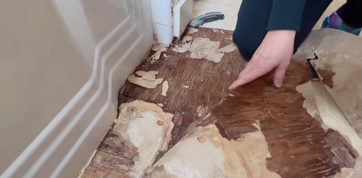 Buckled hardwood floor torn out during water damage restoration in Lincoln, NE