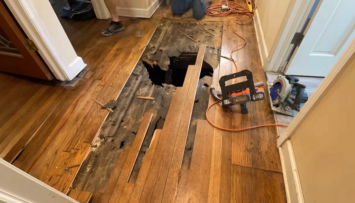 Structural drying equipment on a water-damaged hardwood floor in Lincoln, NE