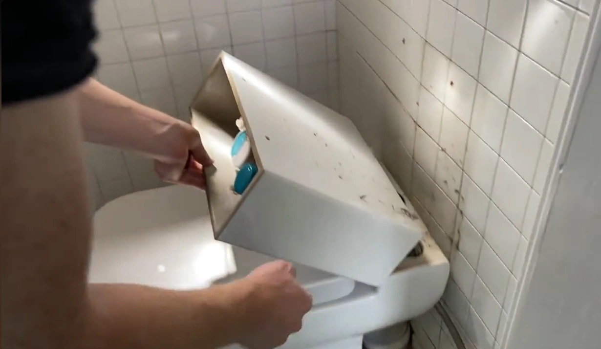 Toilet tank removal after a bathroom plumbing failure in Lincoln, NE