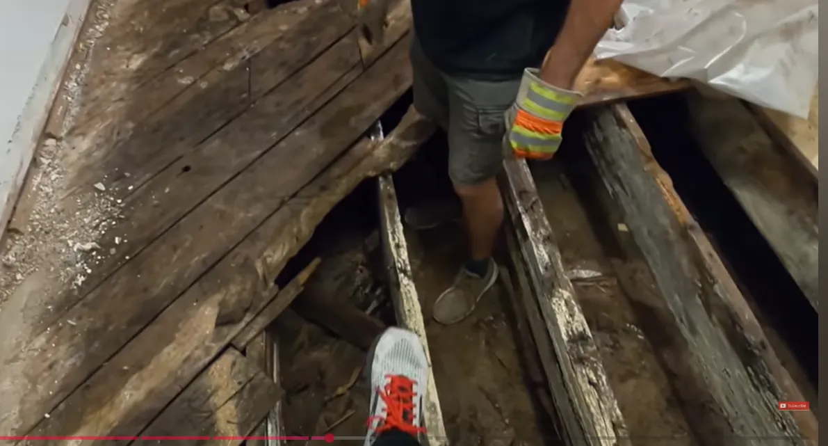 Technician performing water extraction on a subfloor in Lincoln, NE